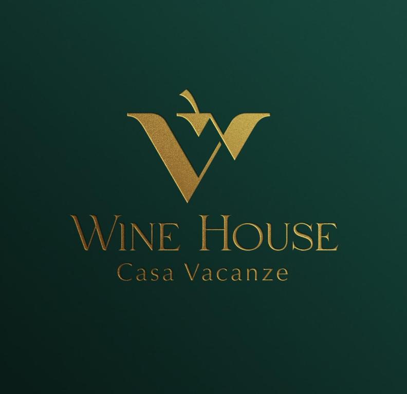 una carta de oro v con el logotipo de una vinoteca en La casa nella vigna [colline del vino], en Capannori