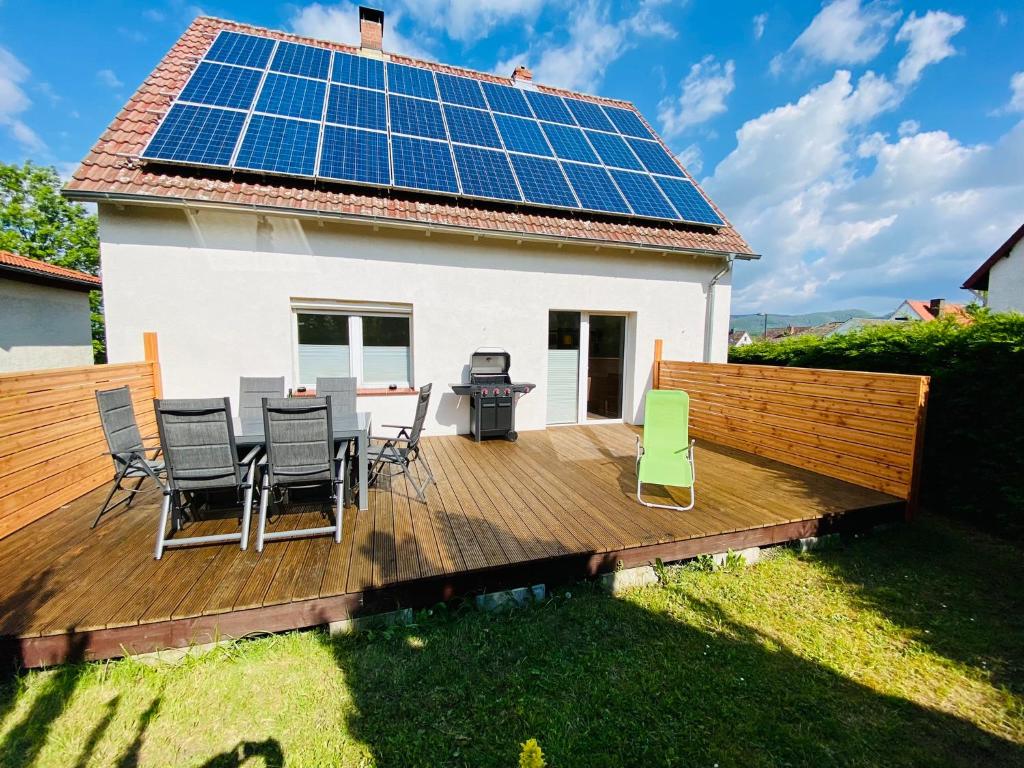 a house with solar panels on the deck at Haus Brockenblick in Bad Harzburg