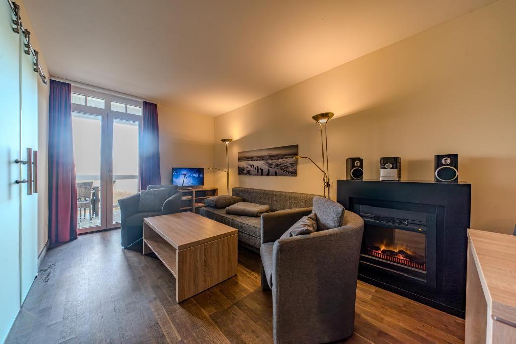 TV a/nebo společenská místnost v ubytování Resort Deichgraf Resort Deichgraf 27-09