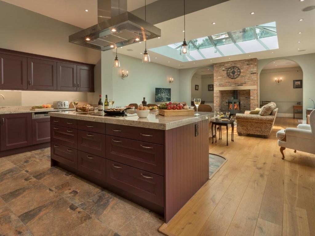 a kitchen with a large island in the middle of a room at 4 Bed in Elvington 55738 in Elvington