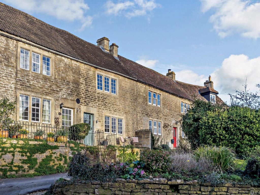 an old brick house with a garden in front of it at 1 bed property in Bradford-On-Avon 82251 in Bradford on Avon