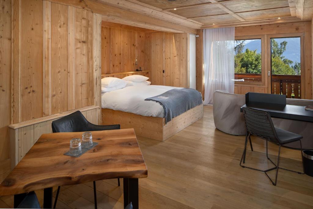 Postel nebo postele na pokoji v ubytování Aïda Hôtel & Spa - "Adults Only" Relais & Châteaux