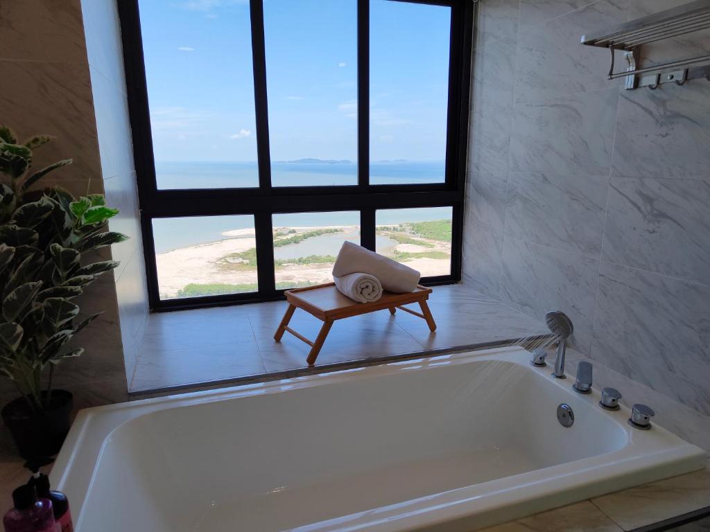 a bath tub in a bathroom with a window at Imperio Homestay Private Bathtub-FreeParking & Wifi in Melaka