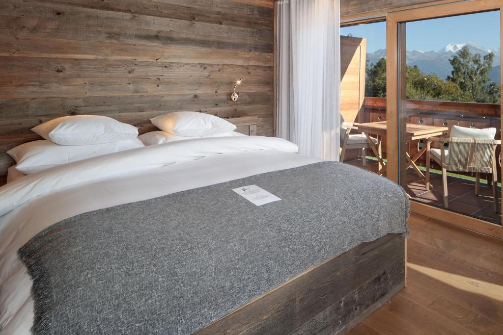 Postel nebo postele na pokoji v ubytování Aïda Hôtel & Spa - "Adults Only" Relais & Châteaux