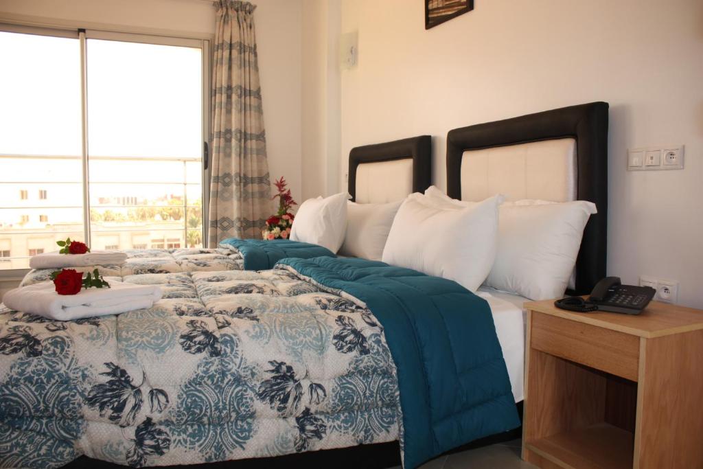 Postel nebo postele na pokoji v ubytování Hotel La Place