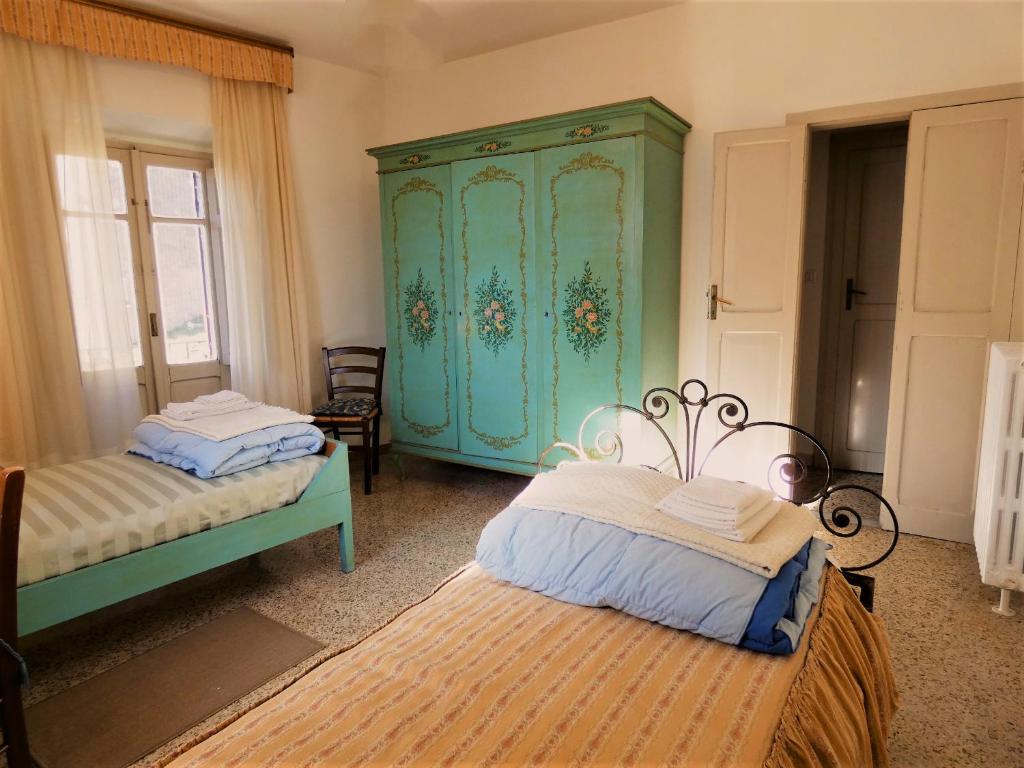Postel nebo postele na pokoji v ubytování Scappo in Umbria, la Loggia