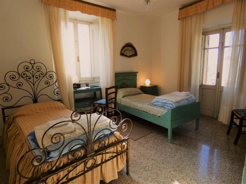 Postel nebo postele na pokoji v ubytování Scappo in Umbria, la Loggia