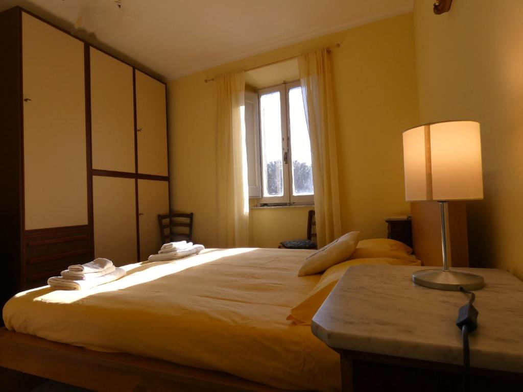 Postel nebo postele na pokoji v ubytování Scappo in Umbria, la Loggia