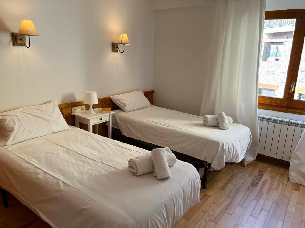 Postel nebo postele na pokoji v ubytování Apartamento en Cal Puigbó Puigcerdà