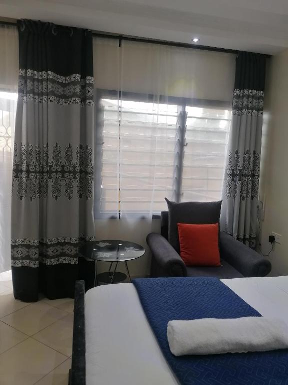 Postel nebo postele na pokoji v ubytování B&S Studio apartment, Voi Town