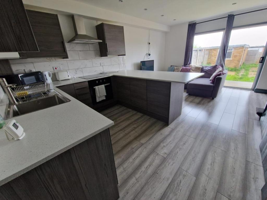 a kitchen with a sink and a counter top at Adoniapro Clacton Lodge in Great Clacton