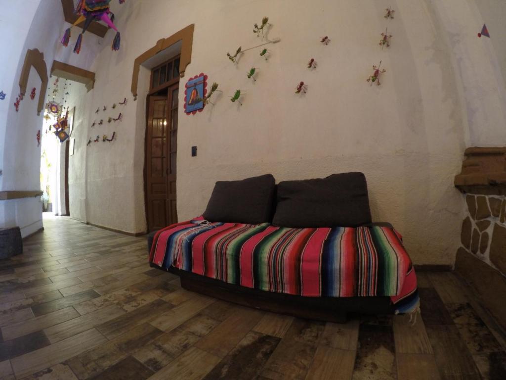 Postel nebo postele na pokoji v ubytování Hospedaje La Mexicana