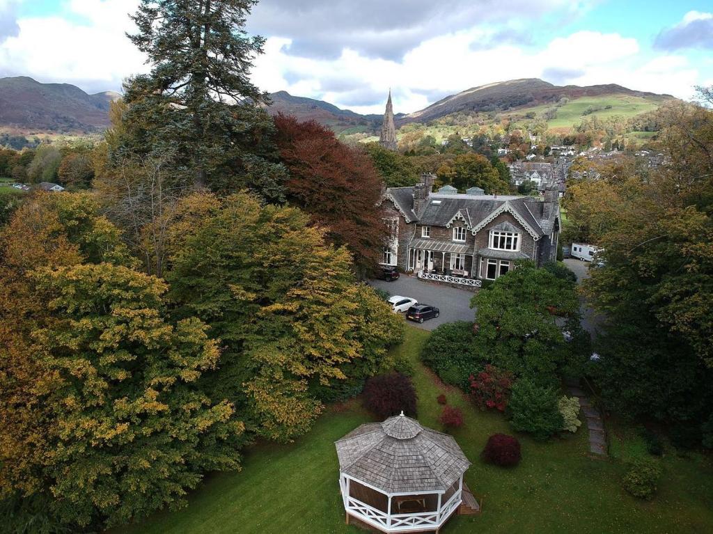 an aerial view of a house with a yard at Ambleside Manor - Vegetarian B&B in Ambleside