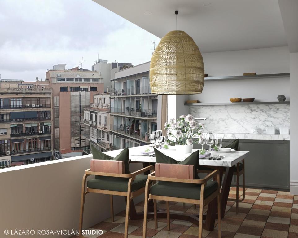 a dining room with a table and chairs and a large window at The Onsider - 5 Bedrooms Penthouse Apartment - Paseo de Gracia in Barcelona