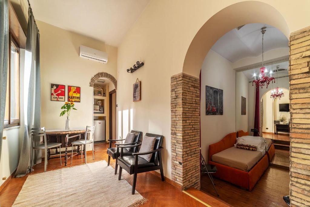 a living room with a couch and a table at Piazza Navona Penthouse in Rome