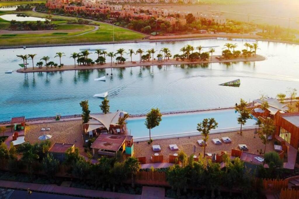 an overhead view of a large pool with a resort at Villa Marrakech piscine privée vue sur Golf&Atlas in Marrakesh