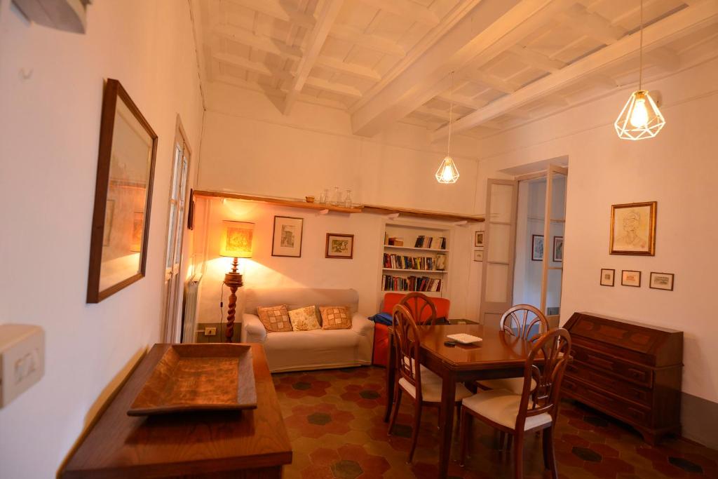 a living room with a table and a couch at Apartment Il Duomo in Poggio Mirteto