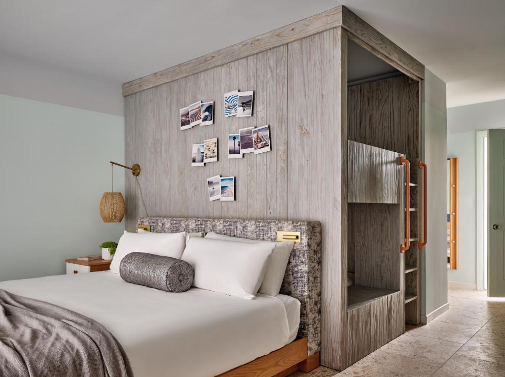 a bedroom with a bed with a wooden headboard at Riviera Beach Resort in South Yarmouth