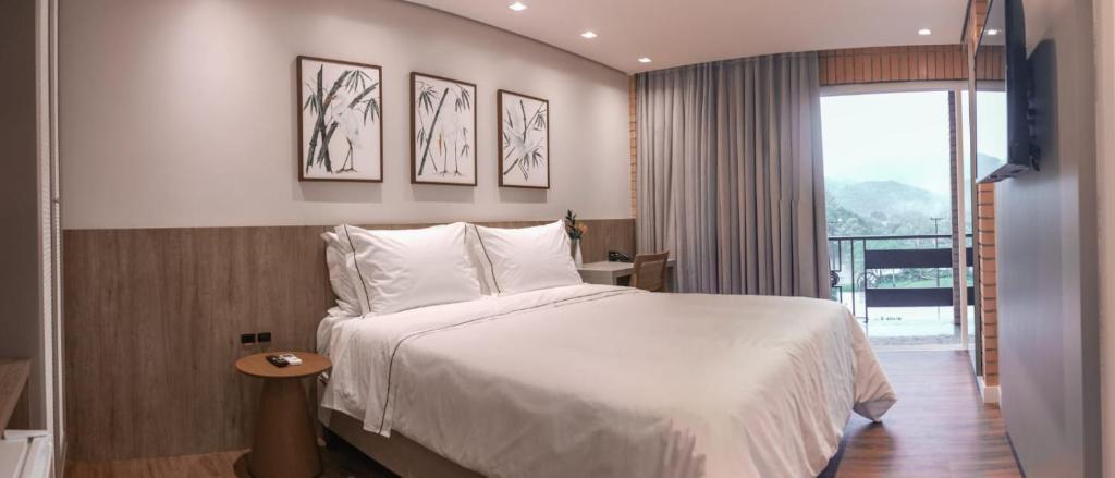 Cama ou camas em um quarto em Village Du Lac Hotel