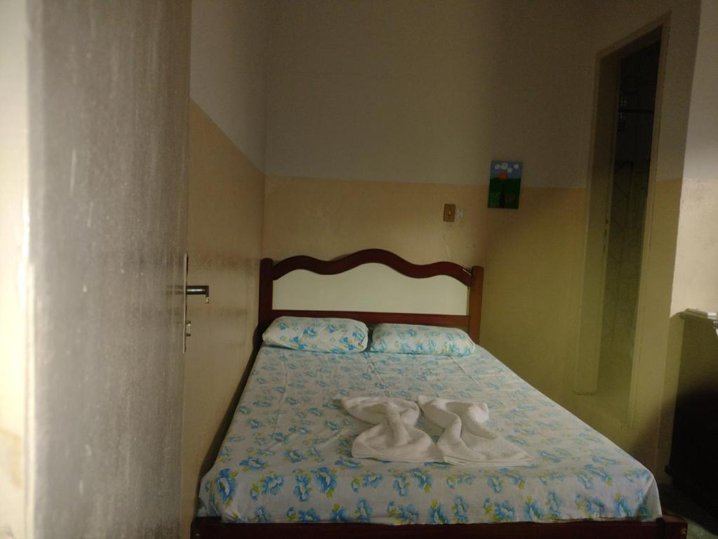 Postel nebo postele na pokoji v ubytování Residencial Ravasco