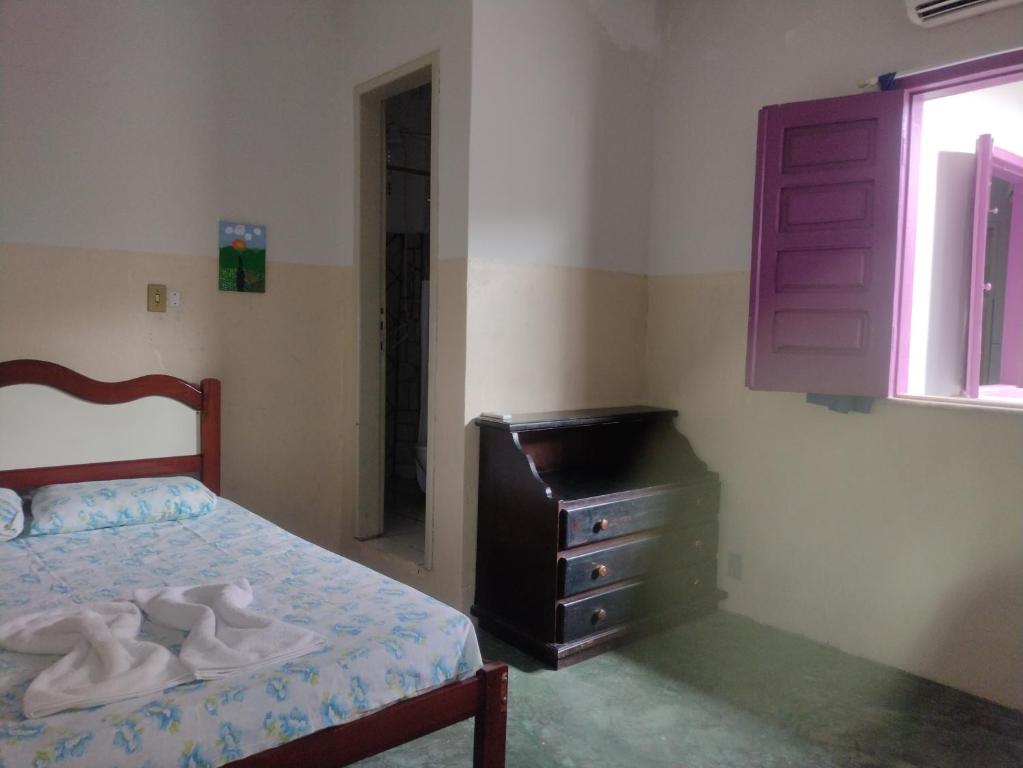 Postel nebo postele na pokoji v ubytování Residencial Ravasco