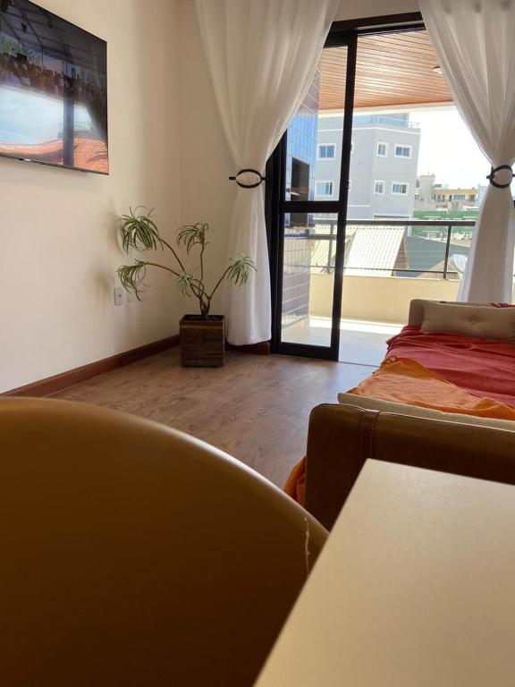Coin salon dans l'établissement Apto a 100m da praia -2 dorms 6 pessoas em Bombinhas