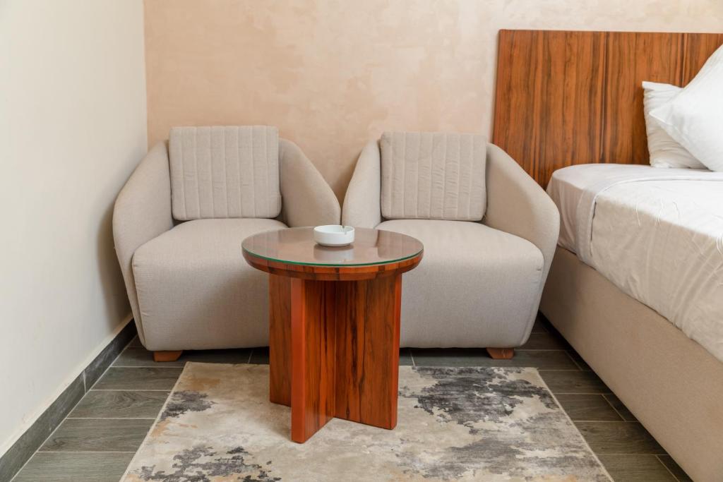 Postel nebo postele na pokoji v ubytování Nile Club hotel