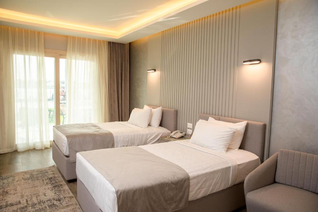Postel nebo postele na pokoji v ubytování Nile Club hotel