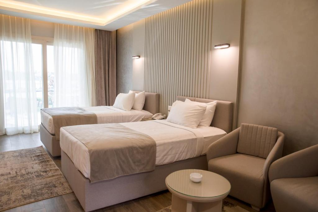 Postel nebo postele na pokoji v ubytování Nile Club hotel