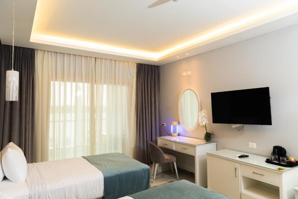 Postel nebo postele na pokoji v ubytování Nile Club hotel