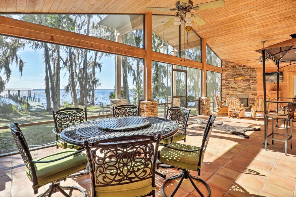 a dining room with a table and chairs at Welaka House with Private Dock on St Johns River in Georgetown