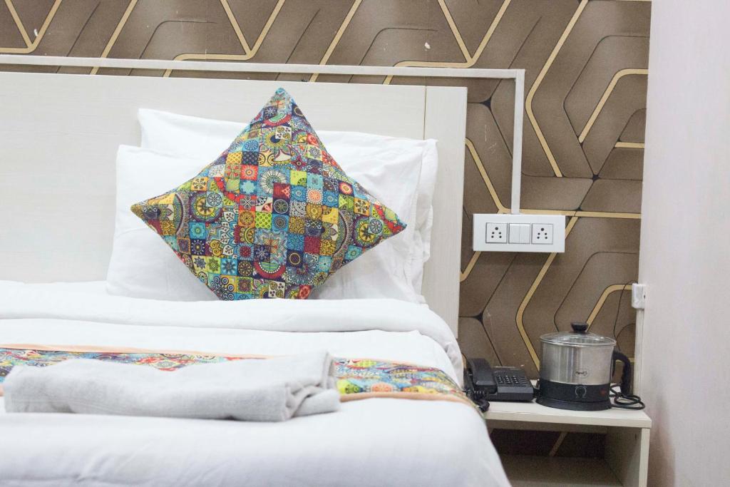 Letto o letti in una camera di JSB HOTEL