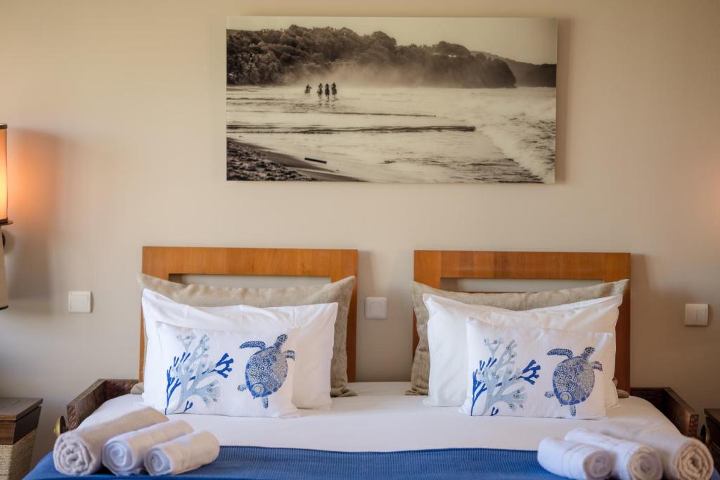 Postel nebo postele na pokoji v ubytování Emeraude Villas - Bay
