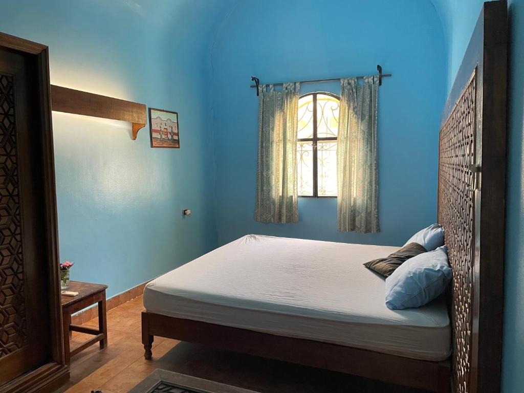 Postel nebo postele na pokoji v ubytování Nubian Holiday House Aswan