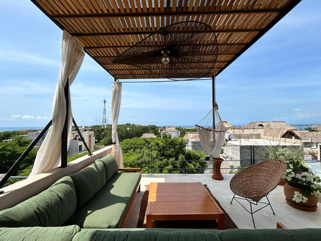 A balcony or terrace at Casa Dakini en la Punta with pool and ocean view