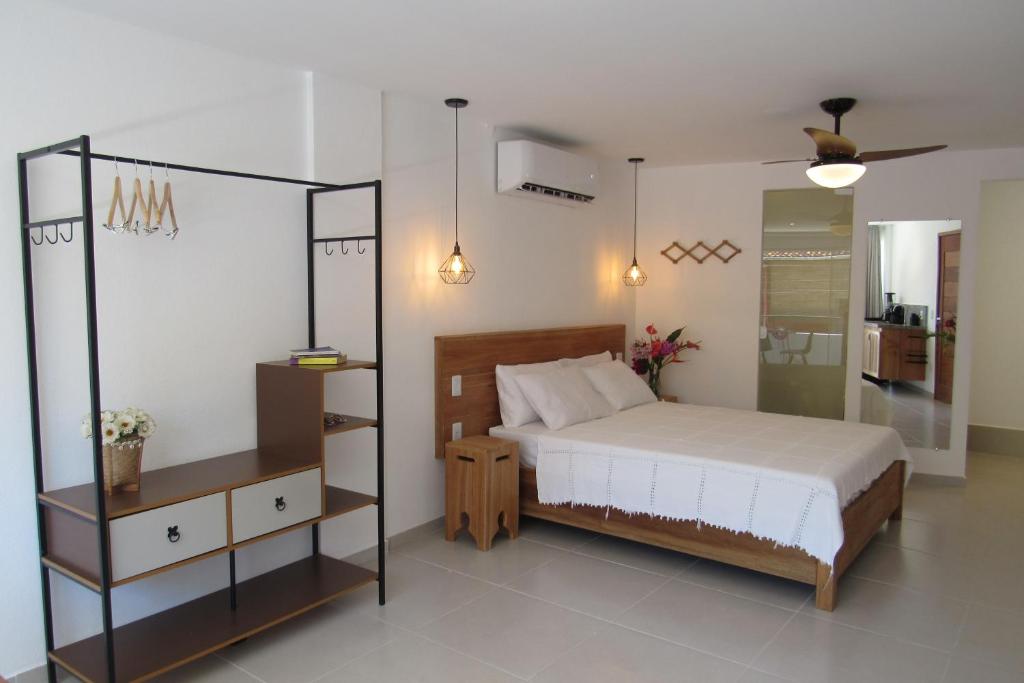 Ένα ή περισσότερα κρεβάτια σε δωμάτιο στο Estúdio Arruda