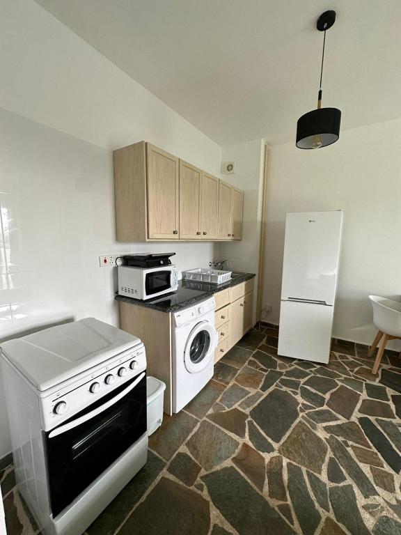 Kuchyň nebo kuchyňský kout v ubytování Tasmaria Aparthotel