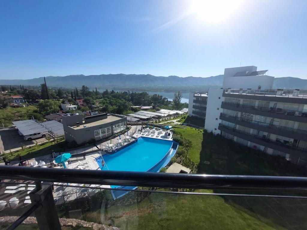 a view from the balcony of a resort with a swimming pool at VENETO VILLAGE MR in Villa Parque Siquiman