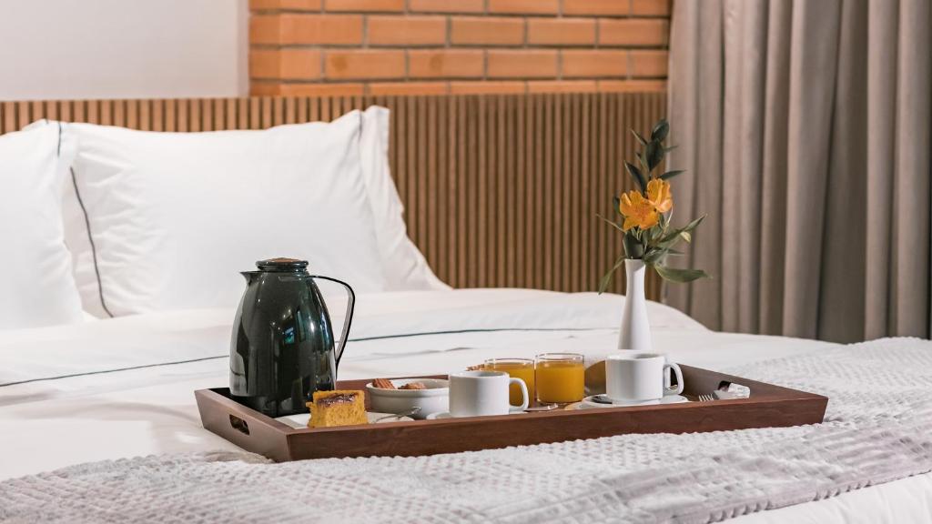 Cama ou camas em um quarto em Village Du Lac Hotel