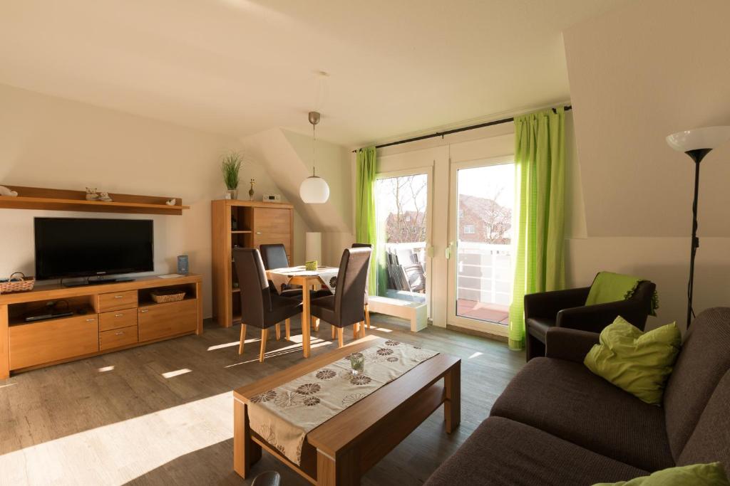 Μια τηλεόραση ή/και κέντρο ψυχαγωγίας στο Dat Ferienhus Norddeich Ferienwohnung 5