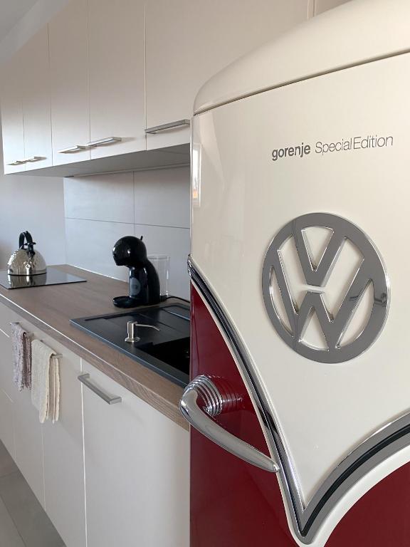 een koelkast met logo in een keuken bij The View 22 in Cerklje na Gorenjskem