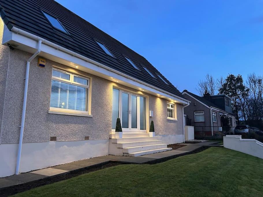 a house with lights on the front of it at 101 Scotia Rooms 