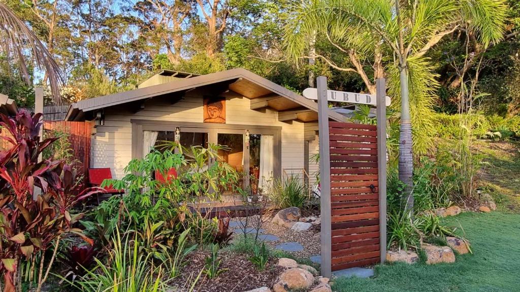 a small house with a garden in a yard at Healing Garden Retreat - Ubud in Gold Coast