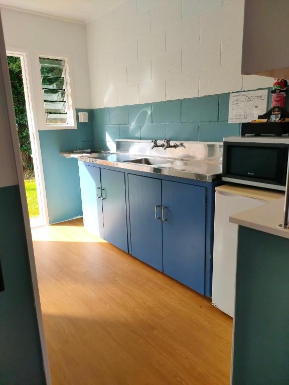 Kuchyň nebo kuchyňský kout v ubytování Aarangi Tui Motel