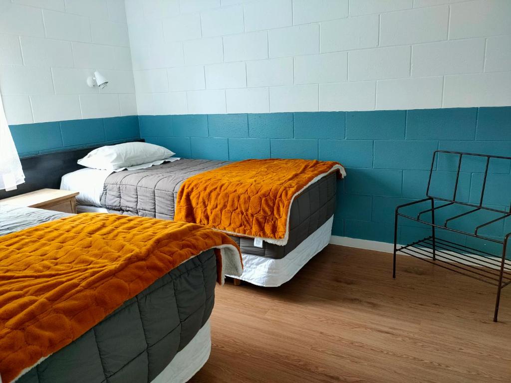 Postel nebo postele na pokoji v ubytování Aarangi Tui Motel