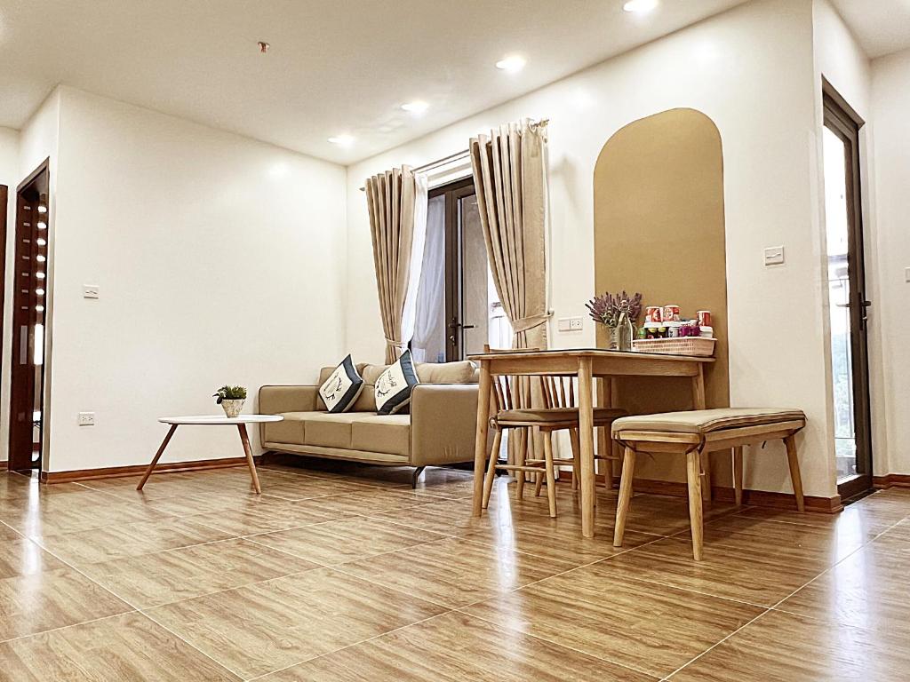 a living room with a couch and a table at Happy Home in Lạng Sơn