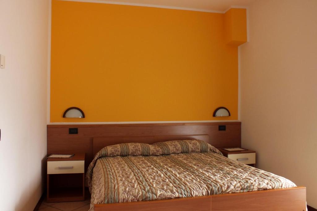 Łóżko lub łóżka w pokoju w obiekcie Albergo Ristorante Innocenti
