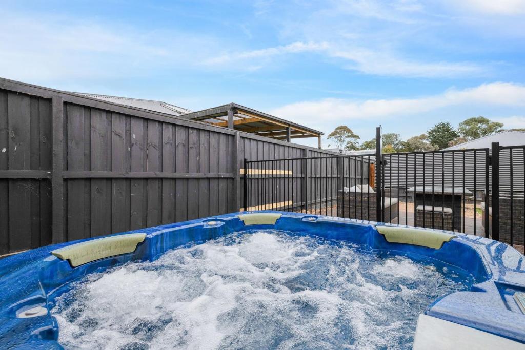 a hot tub in a backyard with snow at Sea you soon in Cowes