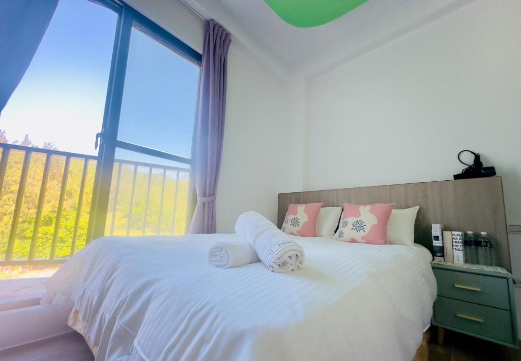 Postel nebo postele na pokoji v ubytování 南灣陽光皮小妞 Pii hostel