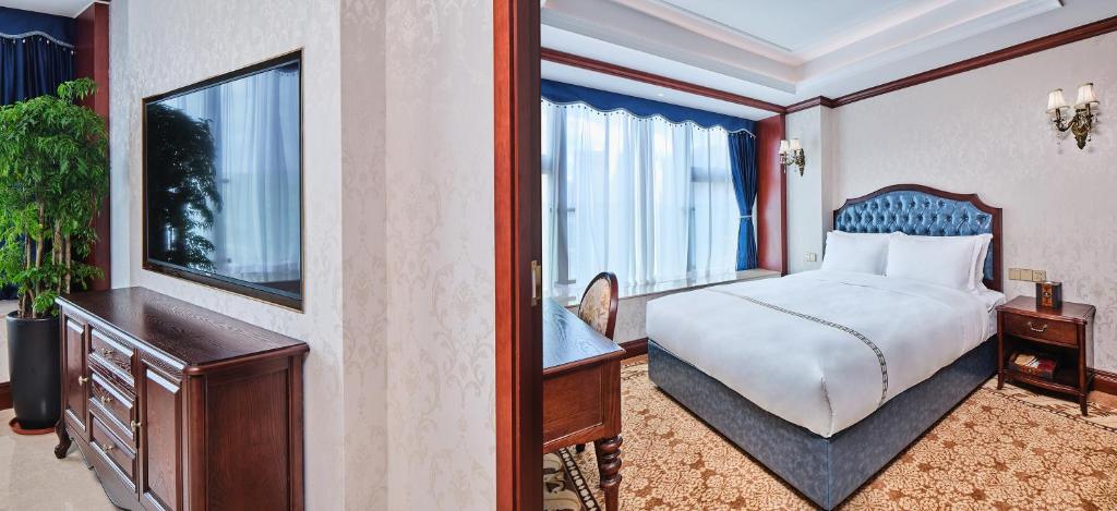 Postel nebo postele na pokoji v ubytování Guangming CIMC Executive Hotel Shenzhen